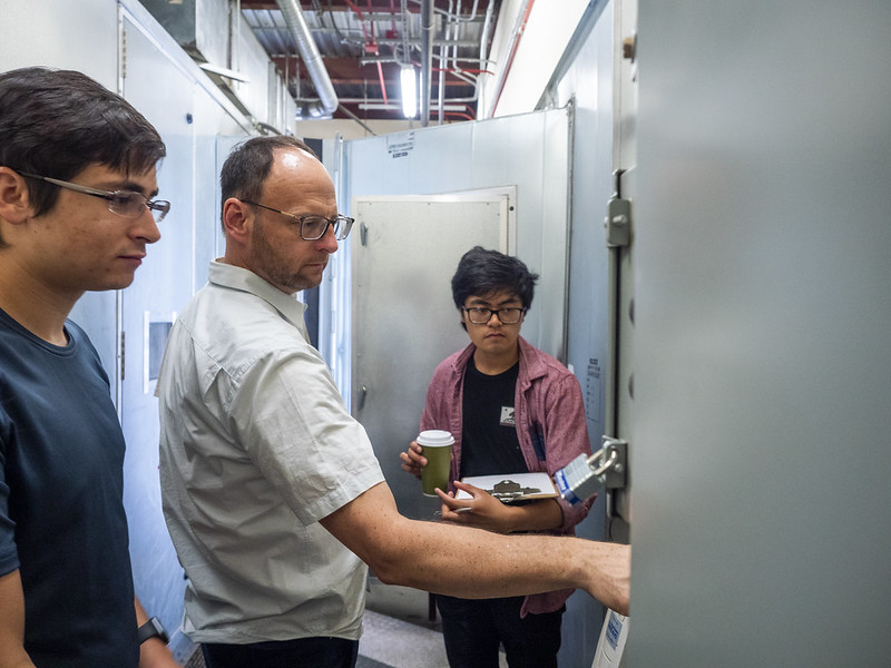 Energy audit bootcamp photo within UC Davis facilities with a professor showing students how something works