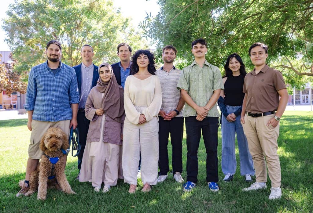 Diverse team of researchers at UC Davis Energy Efficiency Institute outdoors.