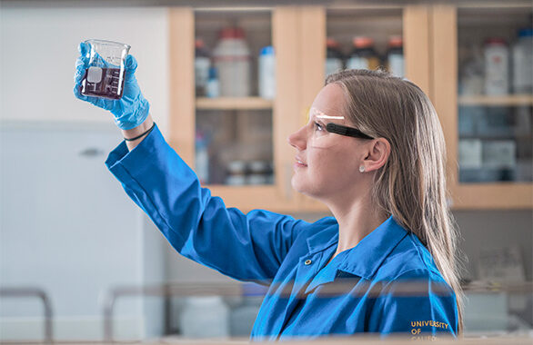 female scientist examining water